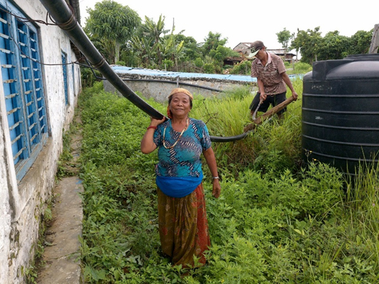 A pipeline connecting the roof of the school building and the rainwater harvesting tank